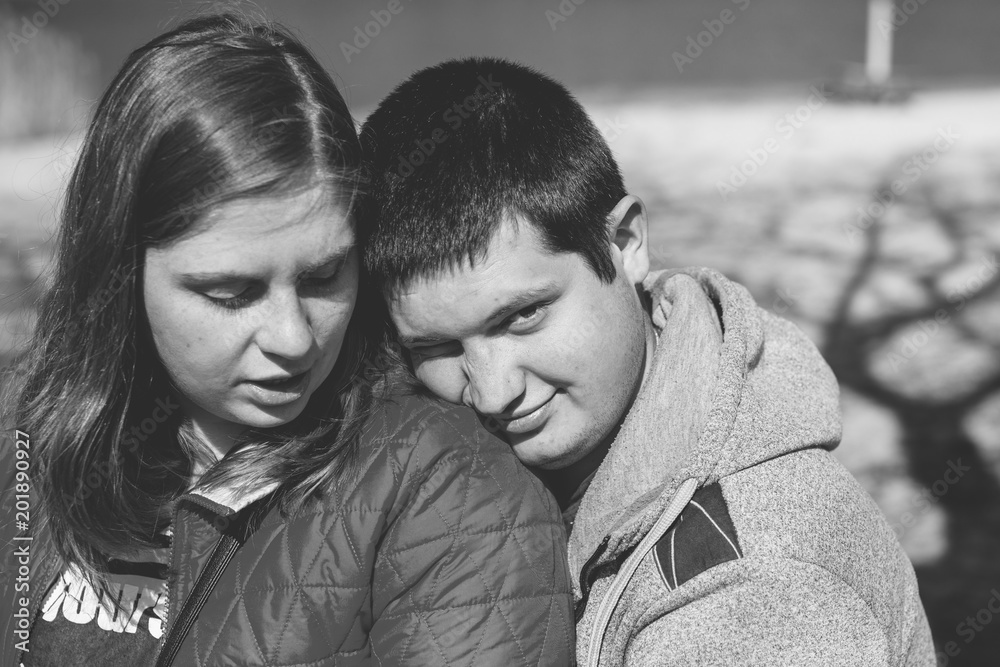 American young couple with overweight walk in park, man and woman together American young couple with overweight walk in park, man and woman together