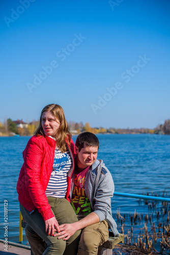 American young couple with overweight walk in park, man and woman together   © T.Den_Team