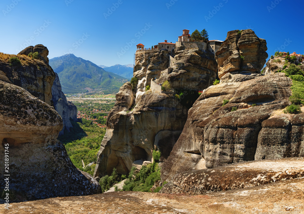The Monastery of Varlaam is the second largest monastery in Meteora mountains, Thessaly, Greece. Panoramic view of Meteora monastery on the high rock at summer time