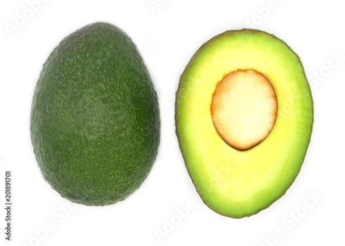 fresh organic green whole and half avocado. food and diet concept.