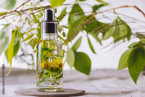 Essential oil, with flowers and natural herbs