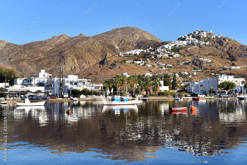 Fishing harbour of Livadi with view of mountaintop town of Pano Chora, Serifos Island, Greece