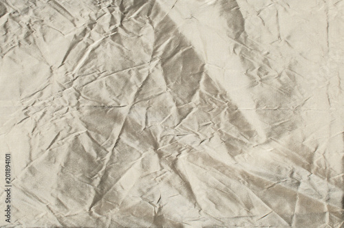 Silver gray color taffeta silk fabric closeup as textile background