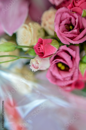 Bouquet with orchids and roses on a beautiful background