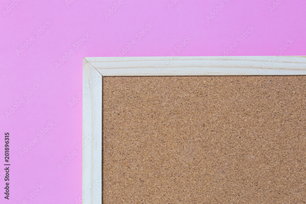 Fototapeta premium Isolate of wooden pin frame on pink background on bottom right