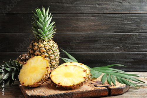 Fresh pineapple on wooden board