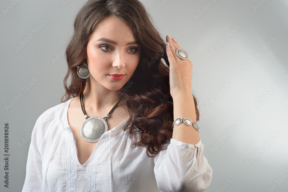 portrait of young beautiful woman with jewelry portrait of young beautiful woman with jewelry