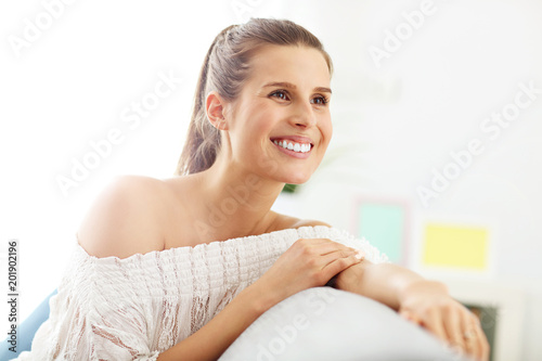 Happy woman relaxing at home