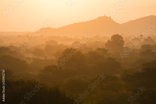 Scenic Sunrise over plain of Bagan on a misty morning  Myanmar