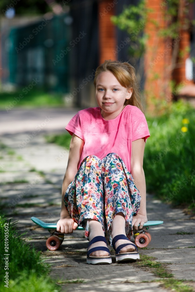 Hipster girl with skate board