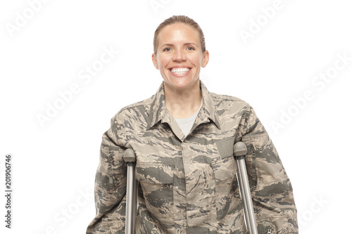 Happy female airman on crutches Fototapeta