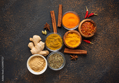 Traditional Indian spices on rusty background