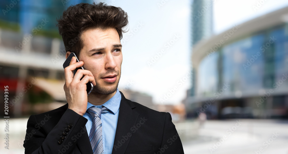 Young businessman on the phone Young businessman on the phone