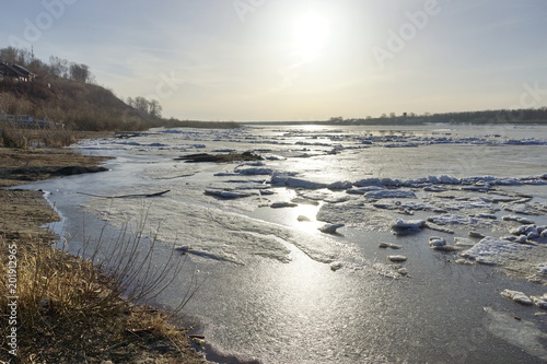 Fototapeta Naklejka Na Ścianę i Meble -  spring ice drift in the morning on the river. the season of warming