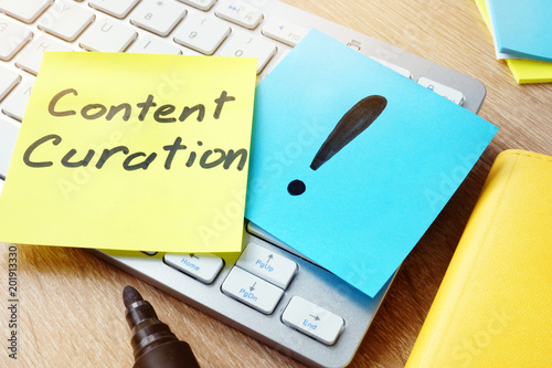 Content Curation. Memo stick on a keyboard. photo