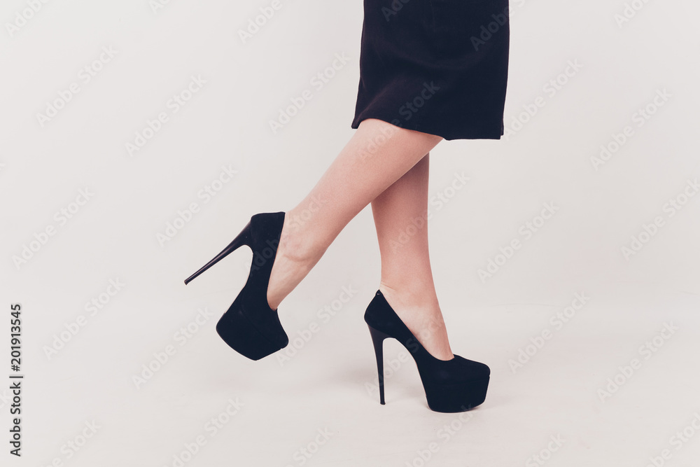 Woman legs with fashion shoes in isolated background Woman legs with fashion shoes in isolated background
