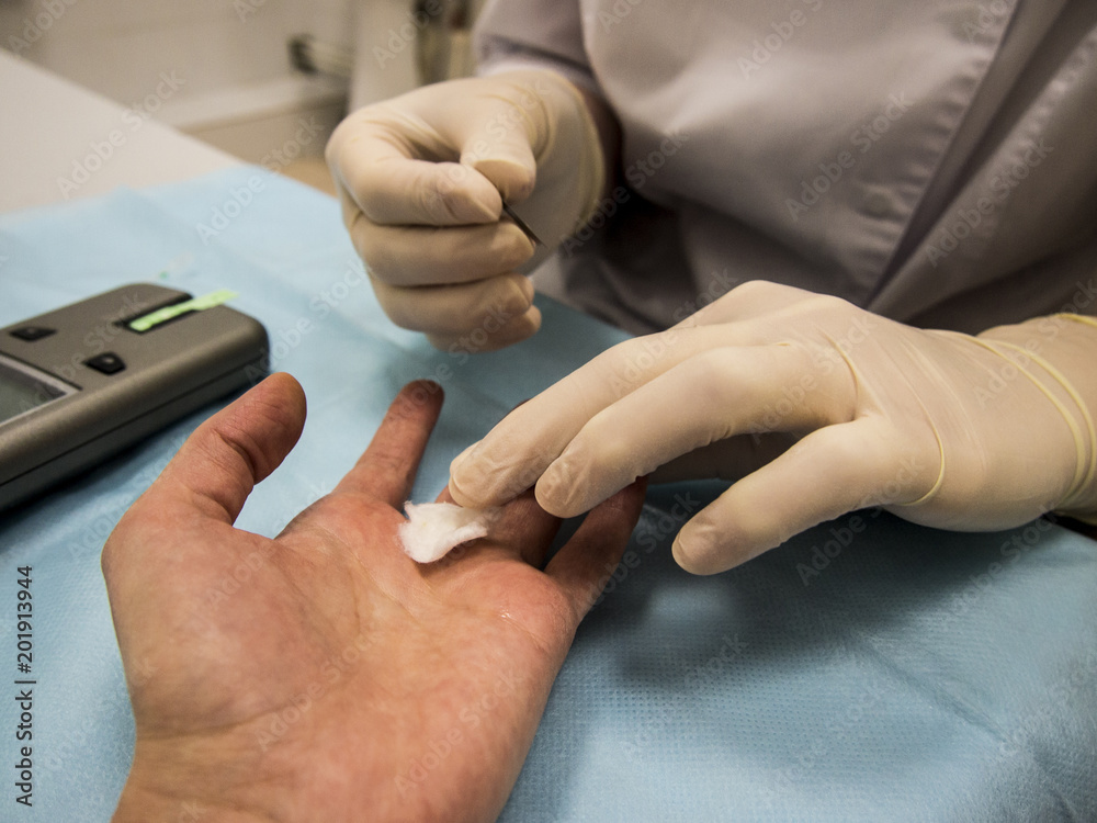 the doctor takes a blood test from the patient the doctor takes a blood test from the patient