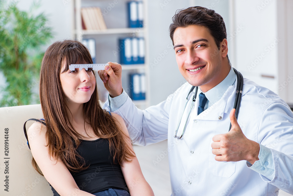 Ophthalmologist is checking up patient in eye doctor hospital Ophthalmologist is checking up patient in eye doctor hospital