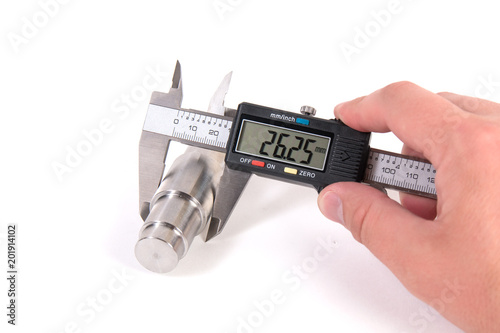 Precise measurement of metal part. Measuring with electronic digital caliper photo