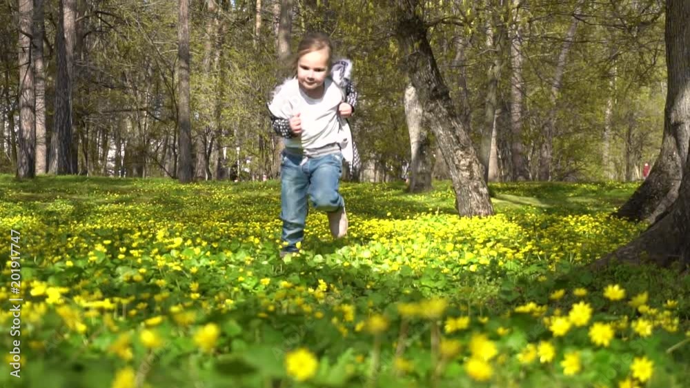 little girl runs in the spring blossoming forest little girl runs in the spring blossoming forest