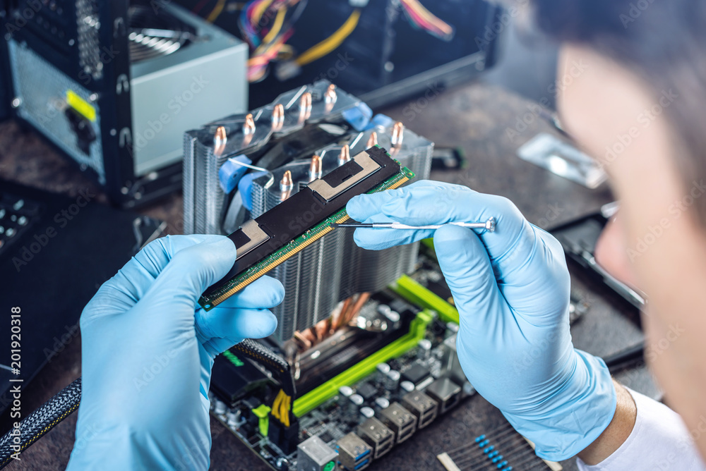 Engineer technician computers in gloves on the hands is reviewing the failure. Concept of repair microchip Engineer technician computers in gloves on the hands is reviewing the failure. Concept of repair microchip