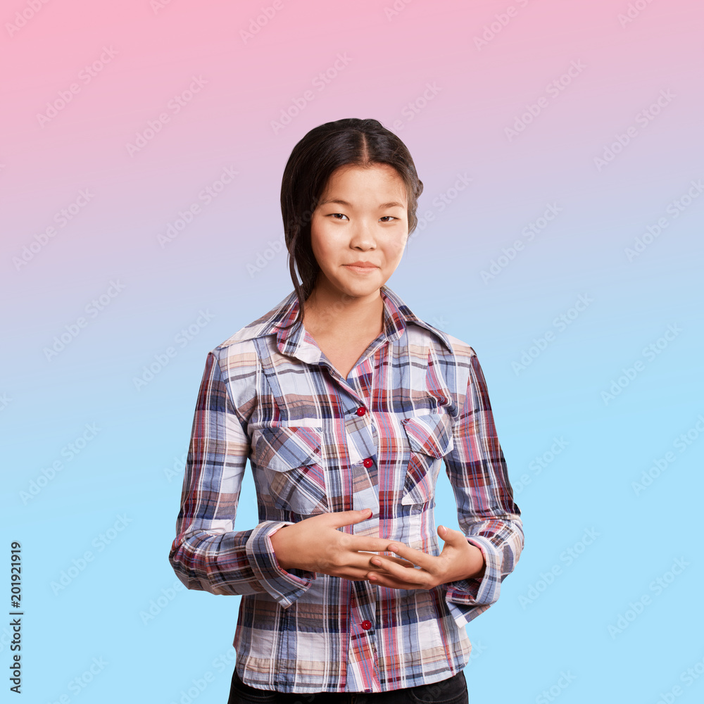 Asian girl shows well done with both hands Asian girl shows well done with both hands