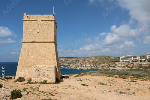 The Ghajn Tuffieha Tower and Golden Bay at the Mediterranean sea in Malta 