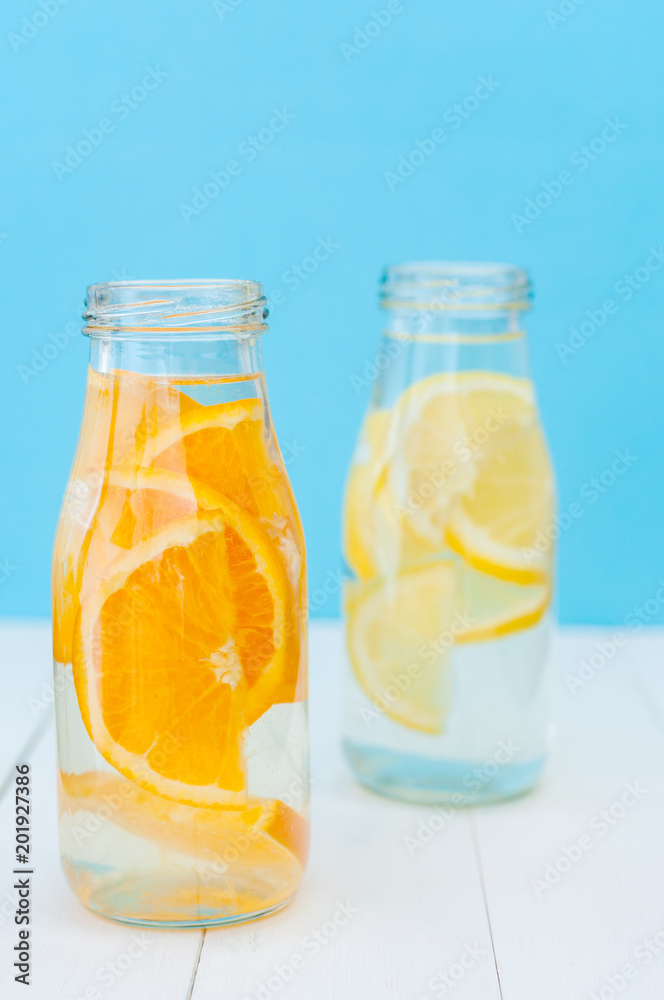 Orange and lemon detox water. Selective focus Orange and lemon detox water. Selective focus