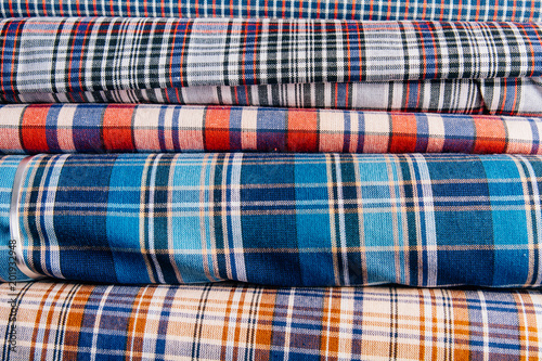 Different types of fabrics lie on each other