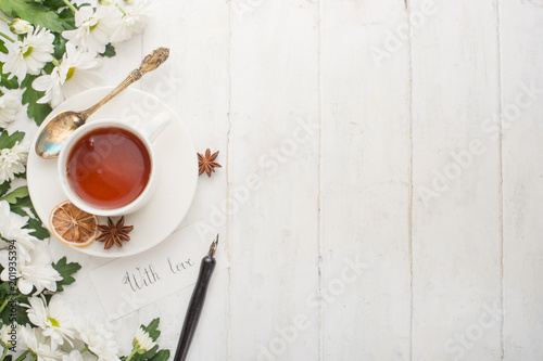 Tea with flowers is made with love. Top view with empty space for inscriptions