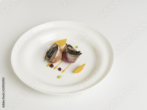 Gourmet small dish food styling on a white background