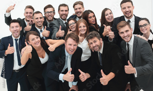 successful business team showing thumbs up