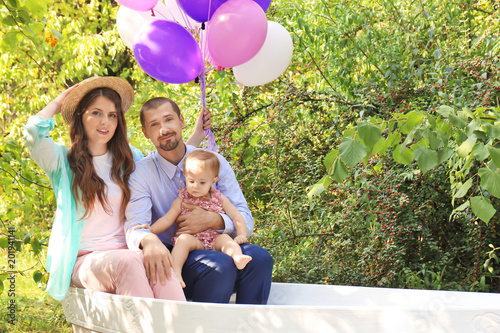 Young family celebrating bi...