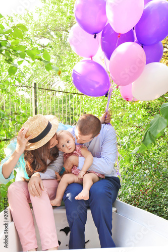 Young family celebrating bi...