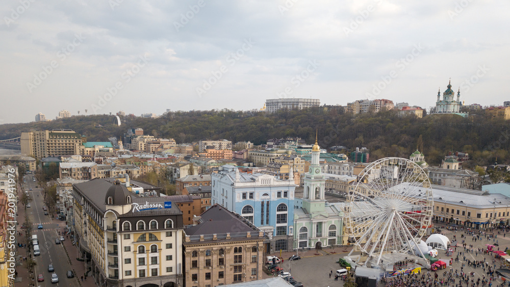 Fototapeta premium KIEV, UKRAINE - April 19, 2018: people and outdoor market on Kontraktova Square in Kiev city in spring.