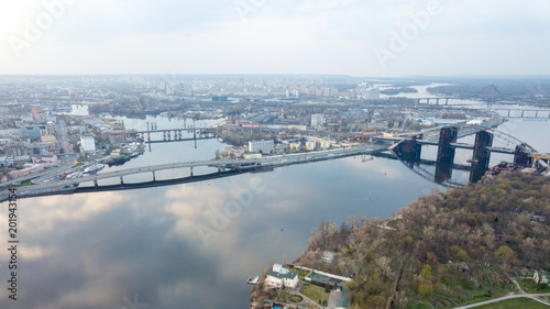 Aerial view of the Kiev (Kyiv) city, Ukraine. Dnieper river with bridges. Obolon district in the background