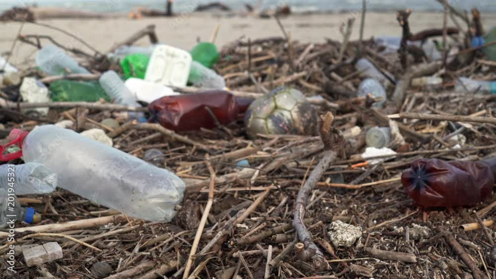 custom made wallpaper toronto digitalEcological catastrophe of the sea. Slide a lot of plastic bottles, garbage on the sandy beach of the Black Sea. Bokeh moving waves in the background. Environmental pollution