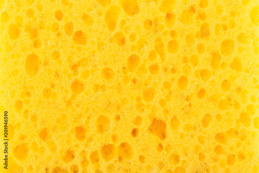 texture yellow foam rubber, synthetic sponge with large pores, close-up background texture yellow foam rubber, synthetic sponge with large pores, close-up background