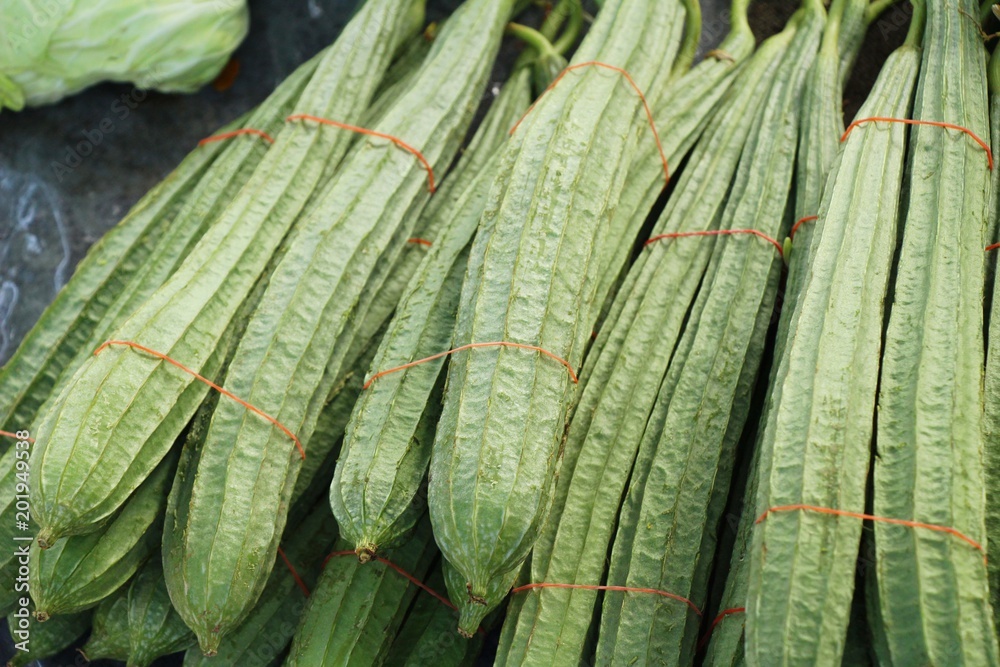 Fototapeta premium Fresh luffa acutangula for cooking in market