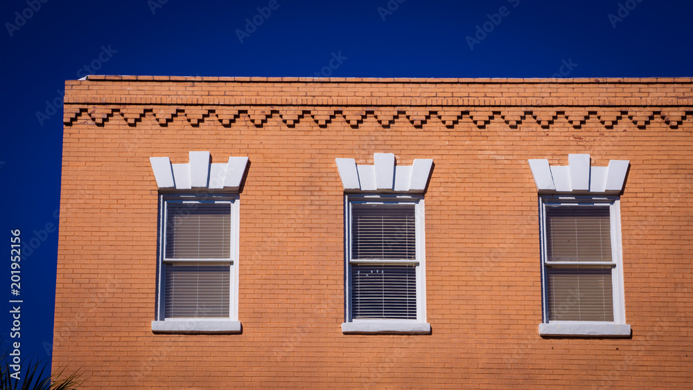 three windows on a  building