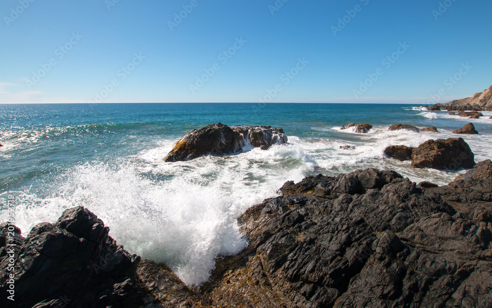 Rocky surf at Cerritos Beach point break between Todos Santos and Cabo San Lucas in Baja California Mexico BCS Rocky surf at Cerritos Beach point break between Todos Santos and Cabo San Lucas in Baja California Mexico BCS