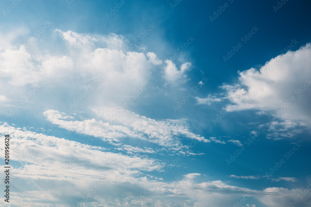 White fluffy clouds in blue sky beautiful air nature background