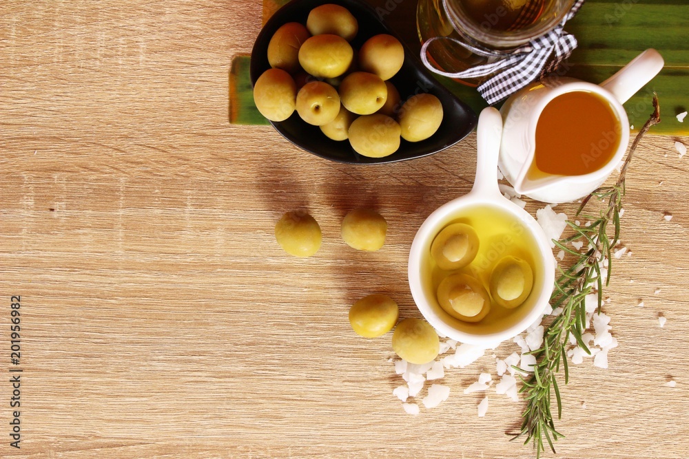 Olive oil for health on wood background Olive oil for health on wood background