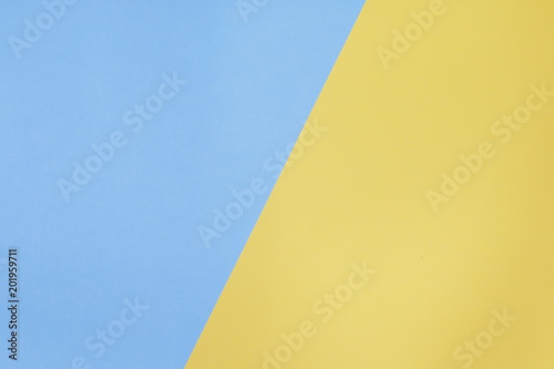 Two color paper with light violet and yellow Overlap on the floor And split half of the image. background photo