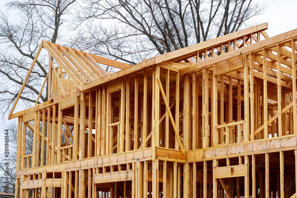 wood framework of new residential home under construction. wood framework of new residential home under construction.