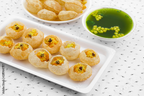 Indian Street Food Pani Puri Also Know as Golgappa or Golgappe is a Common Street Snack From India. It Consists of a Round, Hollow Puri Filled With a Mixture of Flavoured Water And Other Chat Items.