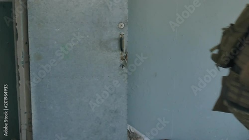 Wallpaper Mural Soldiers in camouflage with military weapons knock out the door and do the seizure of the old building, the military concept Torontodigital.ca