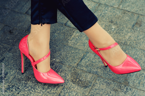 The girl wears classic high-heeled shoes. Model posing on the street. Elegant outfit. © fisher05