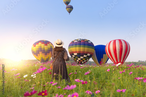 Woman tourist is enjoy traveling at balloon festival in Chiangrai.