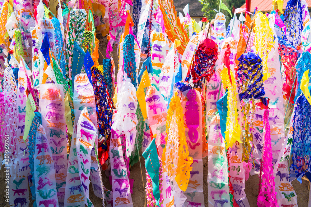 Songkran Festival brings the annual flag and sand into the temple during Songkran Festival in northern Thailand.